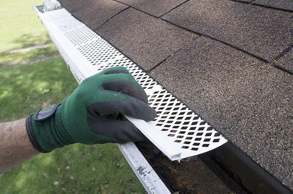 installing gutter guards can prevent clogged gutters, reduce the need for frequent cleaning, and protect your home from water damage